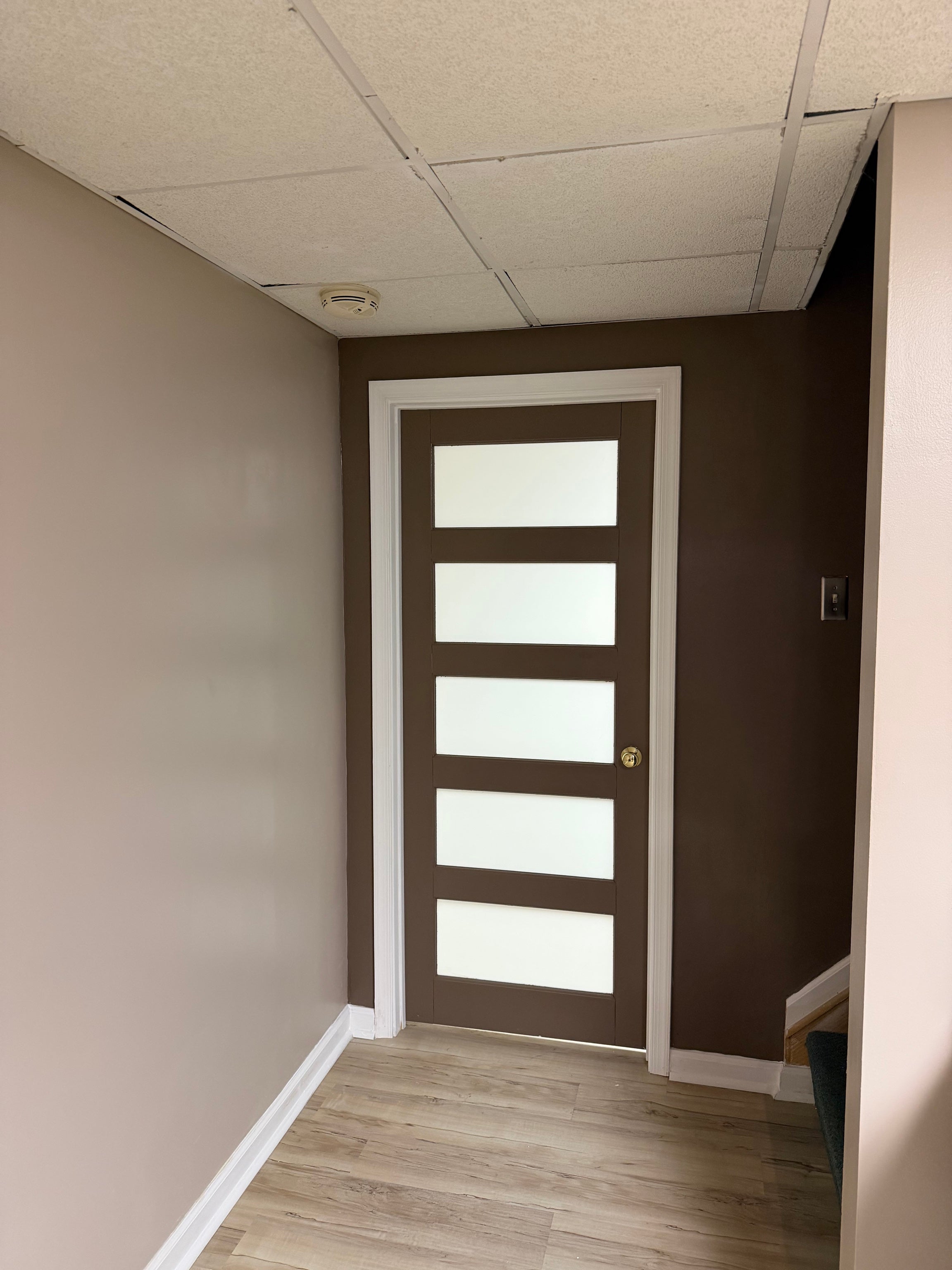 Finished interior doorway with modern door and trim