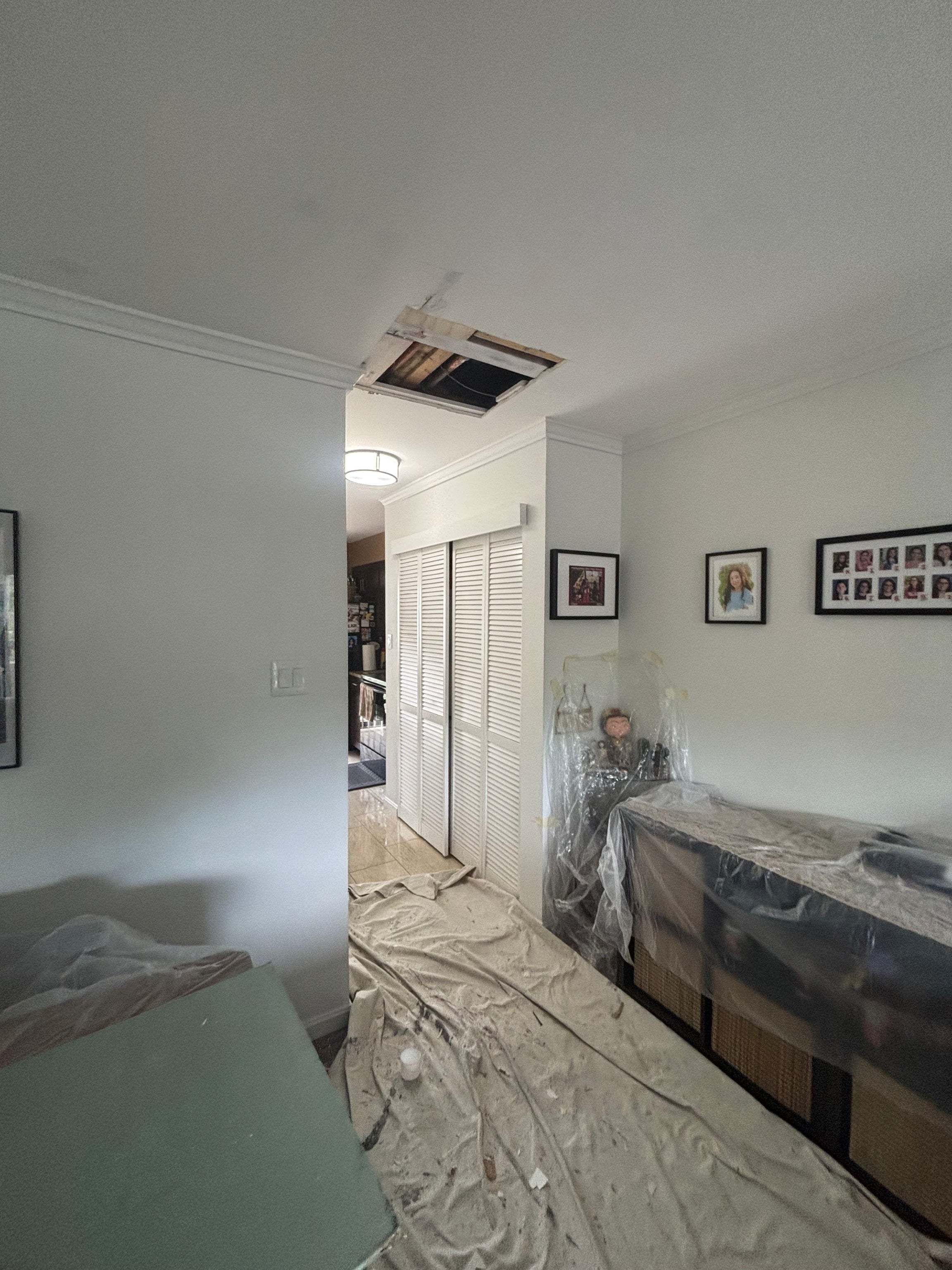Drywall ceiling opening before repair