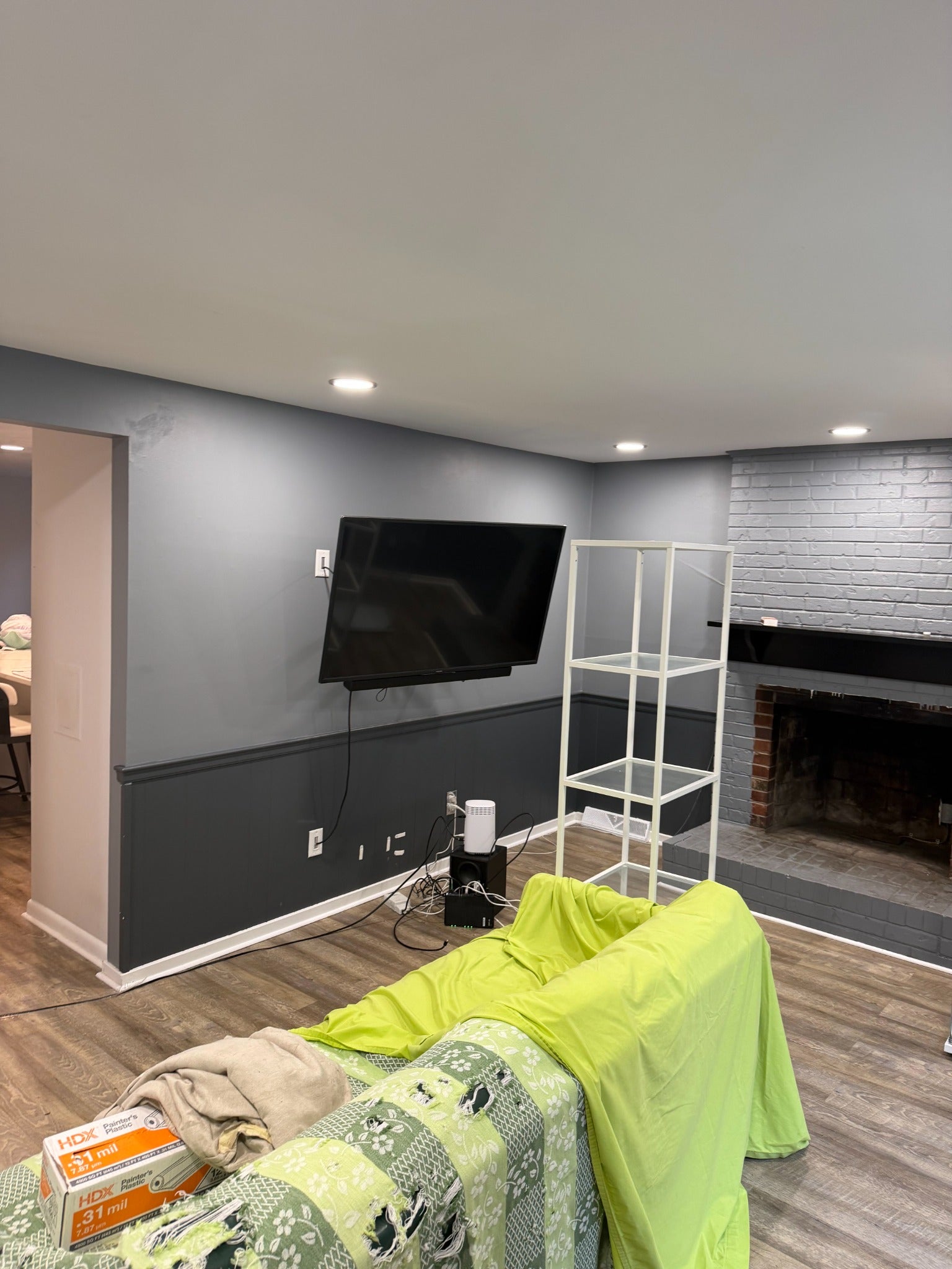 Living room before interior painting with gray walls and dark trim